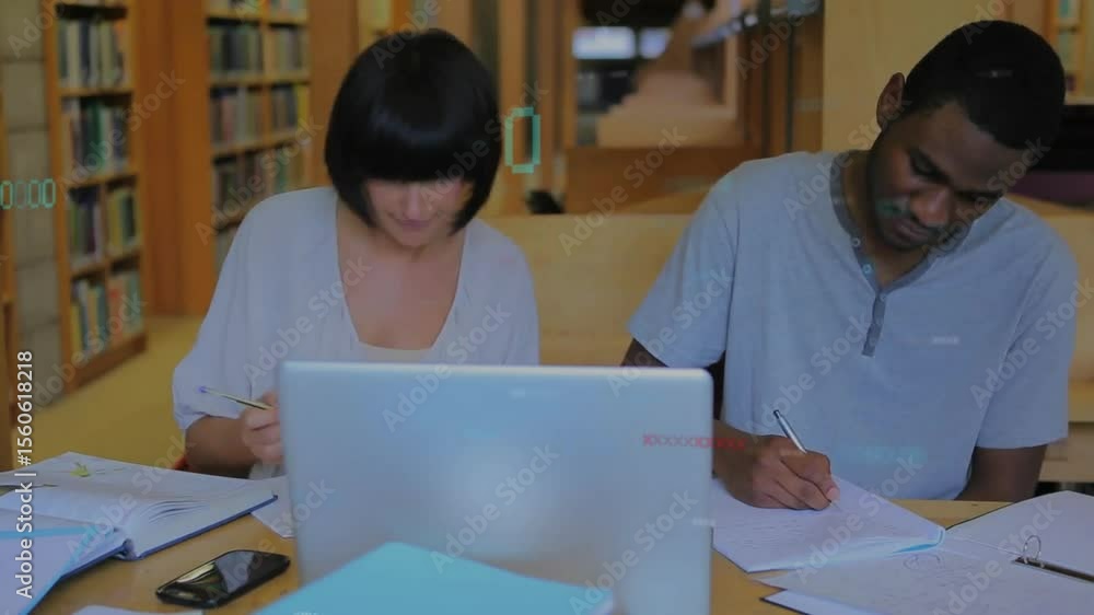 Aufkleber students leaning into laptop, writing in notebooks at library table collaborating on coursework