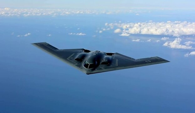 Stealth Bomber B-2 Spirit Flying High Above Ocean Clouds Aerial View Powerful Military Aircraft