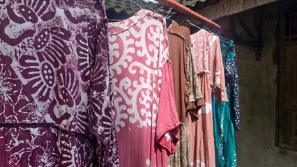 Vibrant Hand-Dyed Batik Fabrics Hanging to Dry