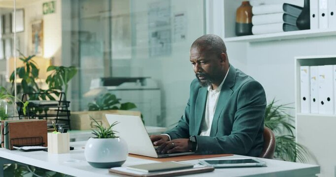 Laptop, typing and reading with business black man in office for attorney research, legal aid and night. Lawyer, online advocate and client advisor with person in law firm for overtime on court case