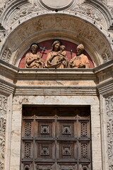 Lunette above the Chiesa di Sant'Agostino Church portal featuring St.John the Baptist-Madonna and...