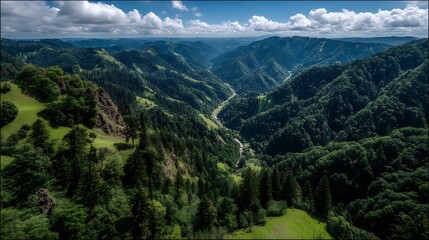 Obraz premium Majestic mountain valley landscape under cloudy sky panoramic aerial view.