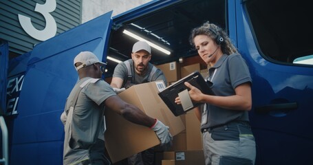 Multiethnic Workers Loading Cardboard Boxes with Online Orders, E-Commerce Goods in Delivery Truck....