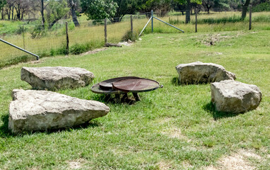 fire pit sitting area in a field for outdoor entertainment