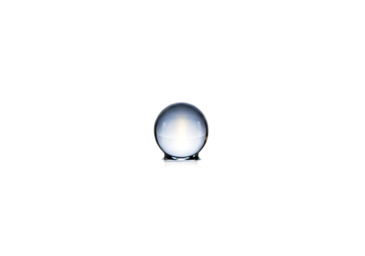A perfectly transparent water drop, isolated on a white background, reflects a blue, abstract world like a tiny, shiny crystal sphere.