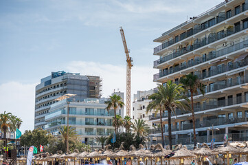 construction of a hotel near the beach with the crane