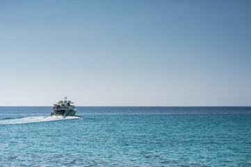 Ship is sailing into the horizon
