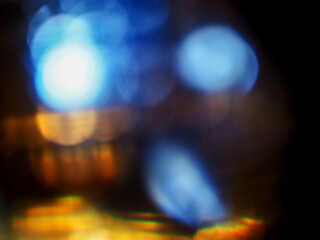 Colorful light leaks on black background for design and special effects. Retro film look. Abstract...