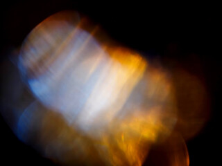 Colorful light leaks on black background for design and special effects. Retro film look. Abstract...
