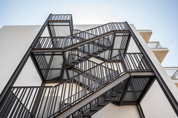 industrial steel stairway on the back of the residential building