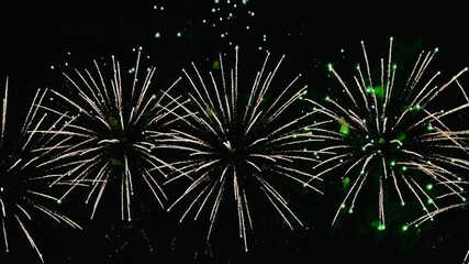  4K. loop seamless of real fireworks background golden shining fireworks with bokeh lights in the night sky. glowing fireworks show. New year's eve fireworks celebration multiple colors  - Powered by Adobe