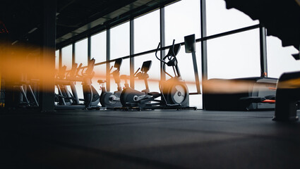 Modern Fitness Center Interior Cardio Equipment and Large Windows