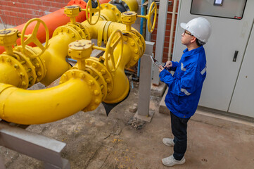 Engineer Overseeing Industrial Cooling System,Factory Technician Performing Machine...