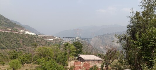 view from the top of the mountain  this place is called chenab rail bridge this is the highest...
