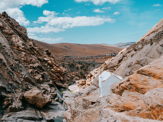 Small White Chapel in Rocky Canyon, Barranco de las Pe&ntilde;itas, Fuerteventura, Canary Islands