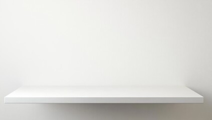 A single, simple, white shelf against a white wall