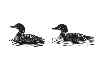 Loons swimming gracefully on rippling water