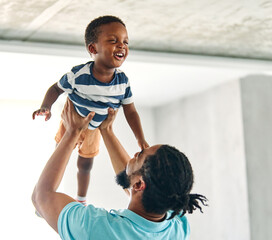 Portrait of father and son having fun at home in bedroom, family life, parenting, love and bonding...