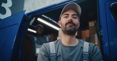 Portrait of Multiethnic Workers Standing Outside of Logistics Retail Warehouse, Smiling and Looking...