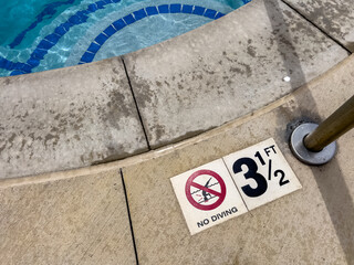 Spa rim and depth marker on concrete surface