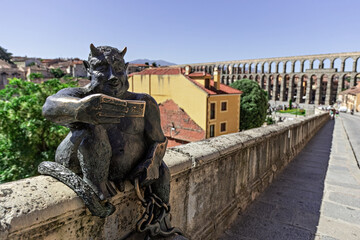 View of the Estatua del Diablo, a bronze statue of a smiling devil taking a selfie photo of itself...