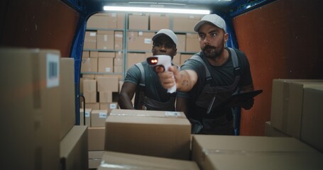 Multiethnic Workers Scanning Cardboard Boxes with Online Orders, E-Commerce Goods in Delivery Truck...
