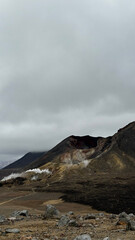 Geothermal steam vents and rugged volcanic landscape on the Tongariro Alpine Crossing in Tongariro...