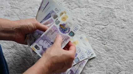 Hands Counting British Pound Sterling Banknotes - Powered by Adobe