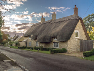 Traditional Medieval English Cob House with Thatch Roof