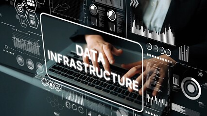 Hands Typing on Laptop Surrounded by Digital Graphics Representing Data Infrastructure and...