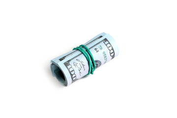 Dollar bills tied with a rubber band lie on a white background.