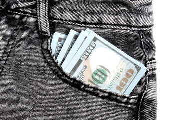 There are hundred dollar bills in the pocket of his jeans.