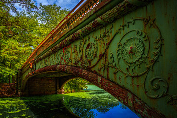 Lullwater Bridge, an extensively ornamented cast iron arch bridge spanning Prospect Park Lake in Brooklyn, New York, USA