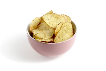 On a white background there is a bowl full of potato chips.