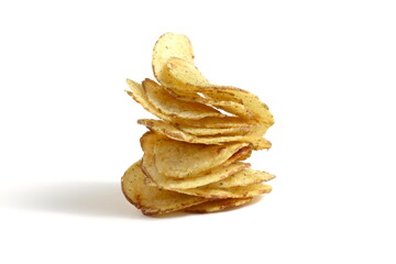 Potato chips are stacked on top of each other on a white background.