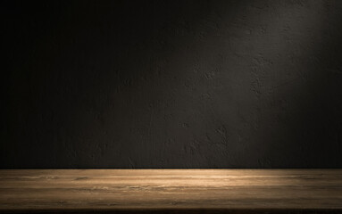 Empty wooden table in a dark room with textured wall background and soft lighting highlighting the surface.