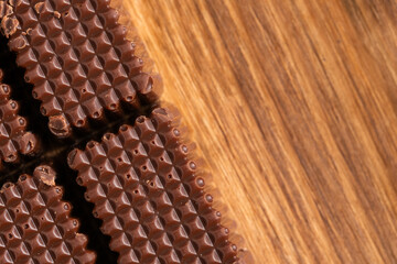Chocolate candy on wooden background. Top view. Copy space.