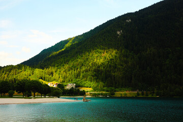 lake in the mountains Dolomites Lake Molveno turquoise water on the background of mountains