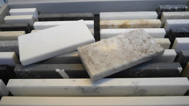 A sample of natural or artificial stone for kitchen countertops and other furniture. Stone texture for modern interior design