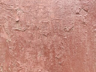 Uniform reddish-brown painted wall texture for minimalist design backgrounds and warm architectural...