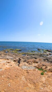 Vertical video of a rocky shore in Alghero. Sardinia