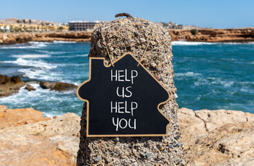 Help you symbol. Concept words phrase Help us help you on beautiful black blackboard. Beautiful...