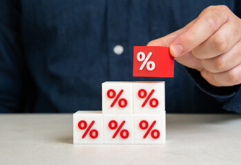 A man collects interest. Discounts and sales. Taxes and fees. Large debts. Financial pressure. Tax...