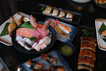 Eel fish sushi, sashimi Nigiri Platter, japanese sushi restaurant, Fresh Tuna and Salmon Slices in modern cafe, traditional food, raw red fish dish, omega 3. High quality 4k footage