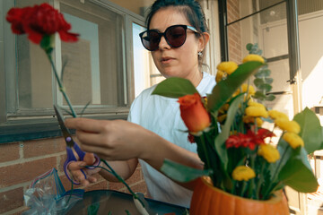 DIY fall flower arrangement in carved pumpkin