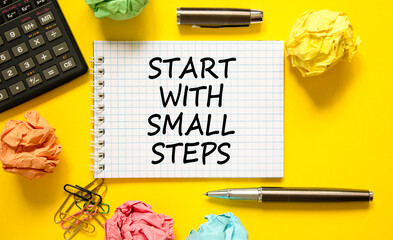 Start with small steps symbol. Concept words phrase Start with small steps on beautiful white note....