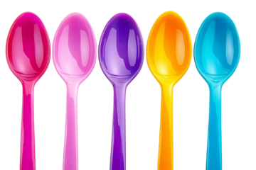 Vibrant spoons in colorful row against white backdrop