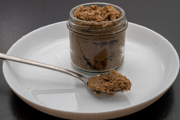 Fresh homemade veal liver pate, chicken pate on a white plate. Delicious homemade food. Options for a buffet.