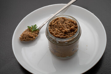 Fresh homemade veal liver pate, chicken pate on a white plate. Delicious homemade food. Options for a buffet.