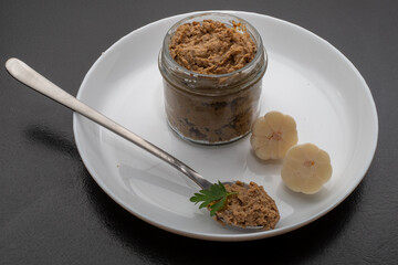 Fresh homemade veal liver pate, chicken pate on a white plate. Delicious homemade food. Options for a buffet.